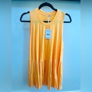 Free people bright peach flowy tank. New with tags.